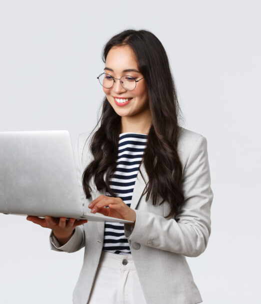 Business, finance and employment, female successful entrepreneurs concept. Professional stylish asian businesswoman fixing project on her way to office, using laptop standing whtie background.